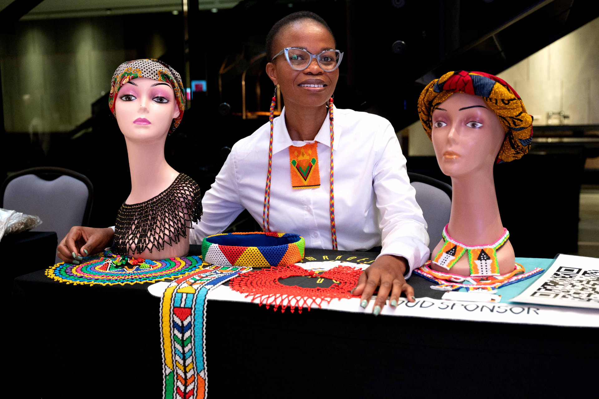 Woman entrepreneur displaying handmade accessories